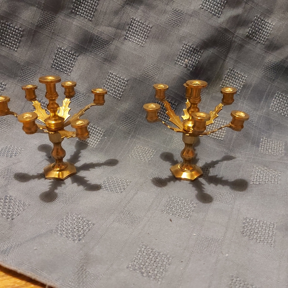 Miniature brass candelabras.